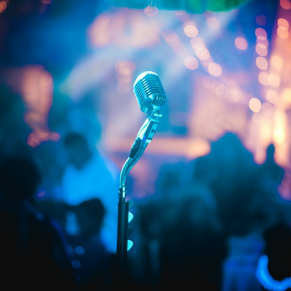 Vintage microphone on a stand in a live venue